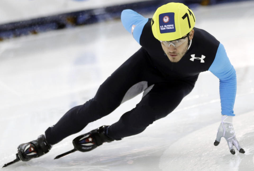 FILE - In this Jan. 5, 2014, file photo, Eduardo Alvarez competes in the men's 1,000-meters during the U.S. Olympic short track speedskating trials in Kearns, Utah. Alvarez became only the third American to earn medals at both the Summer and Winter Olympics when the United States beat defending-champion South Korea 7-2 Thursday night, Aug. 5, 2021, to gain a berth into this weekend’s gold medal game against host Japan. (AP Photo/Rick Bowmer, File)