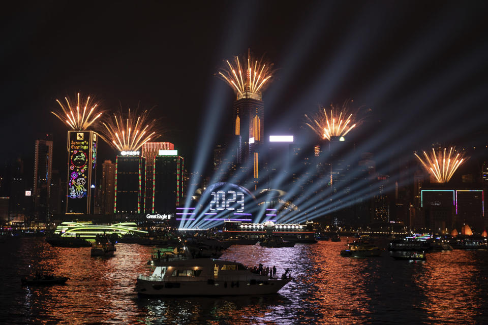 Fireworks are seen over Victoria Harbour at midnight on New Years Sunday Jan. 1, 2023 in Hong Kong. (AP Photo/Anthony Kwan)