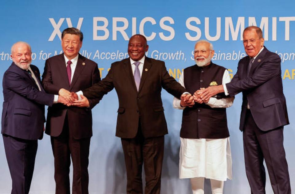 Brics leaders pose for family photo during the 2023 Brics Summit at the Sandton Convention Centre in Johannesburg (POOL/AFP via Getty Images)