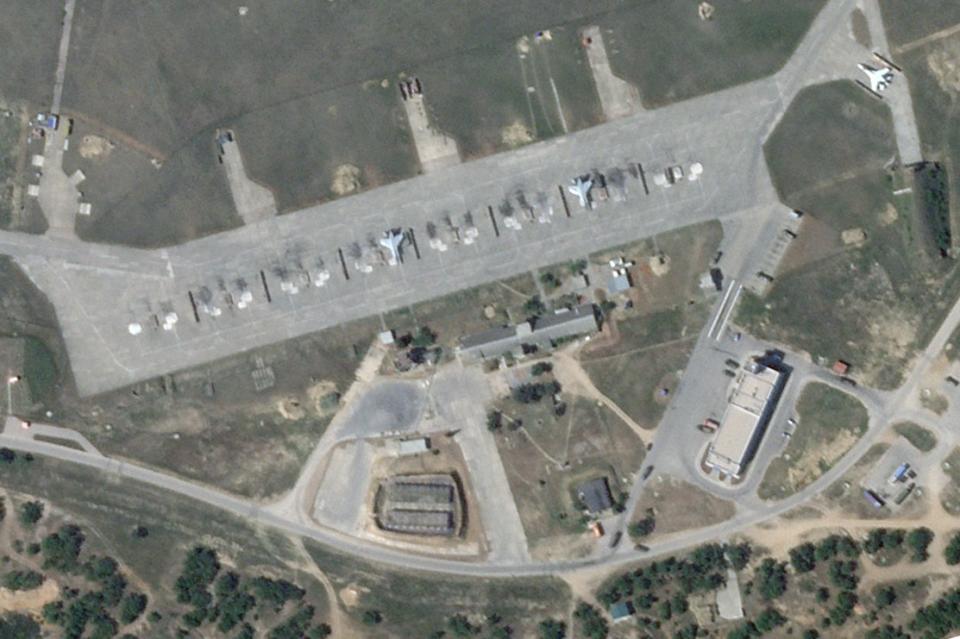 This is what the apron looked like on May 1st. You can see what looks like a bermed ammo dump intact along with a pair of MiG-31s. Where the MiGs are parked and this ammo dump area look to have been struck directly. <em>PHOTO © 2024 PLANET LABS INC. ALL RIGHTS RESERVED. REPRINTED BY PERMISSION</em>