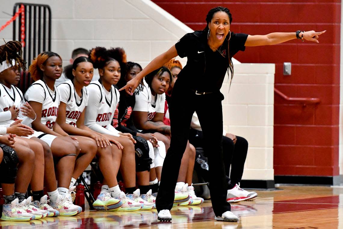 Warner Robins’ head coach Rebecca White yells instructions to her team during the Demonettes GHSA second round playoff game against Harris County Friday night. Warner Robins advanced the to quarterfinals with a 55-43 win.