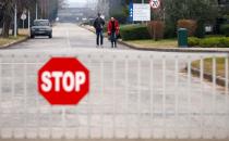 Former workers walk in the Aluminij Mostar aluminium factory in Mostar