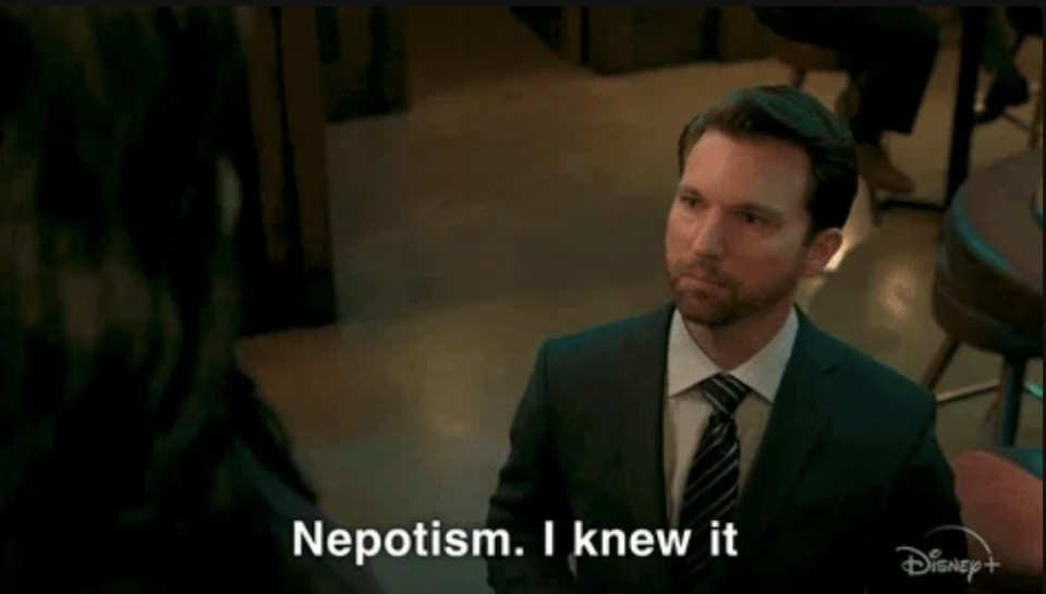 Scene from a TV show with a suited character saying, "Nepotism. I knew it," in the subtitle. The Disney+ logo is present in the corner