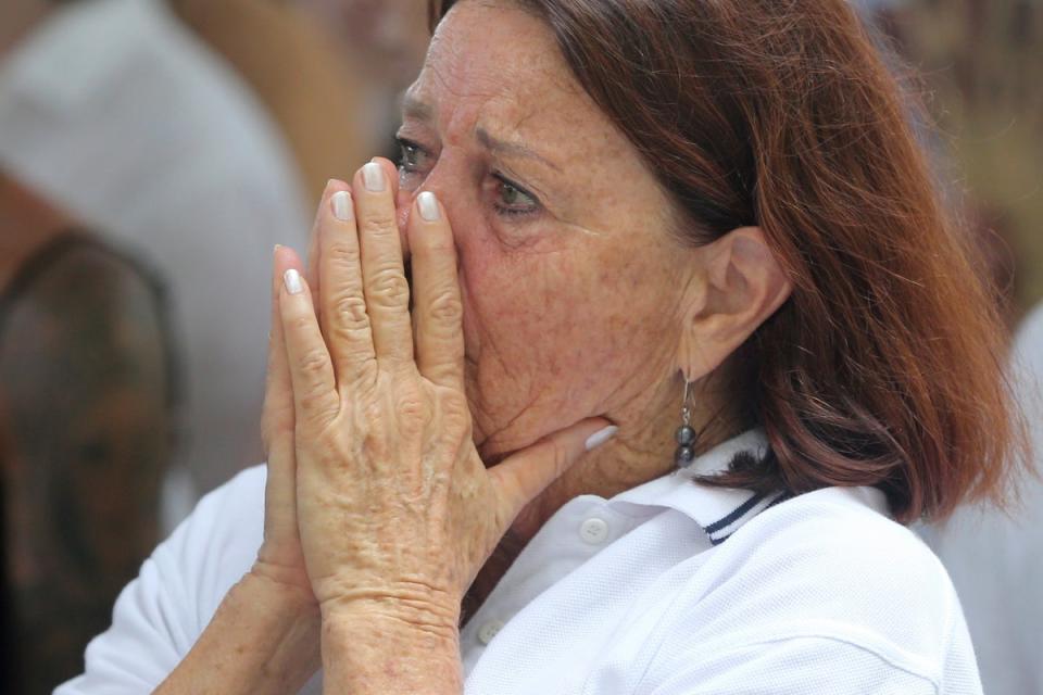 A victim’s relative reacts during the commemoration of the 20th anniversary of the Bali bombing at the Australian Consulate in Denpasar, Bali, Indonesia, on 12 October (EPA)