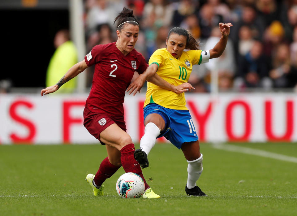 England's Lucy Bronze in action with Brazil's Marta  Action Images via Reuters/Lee Smith