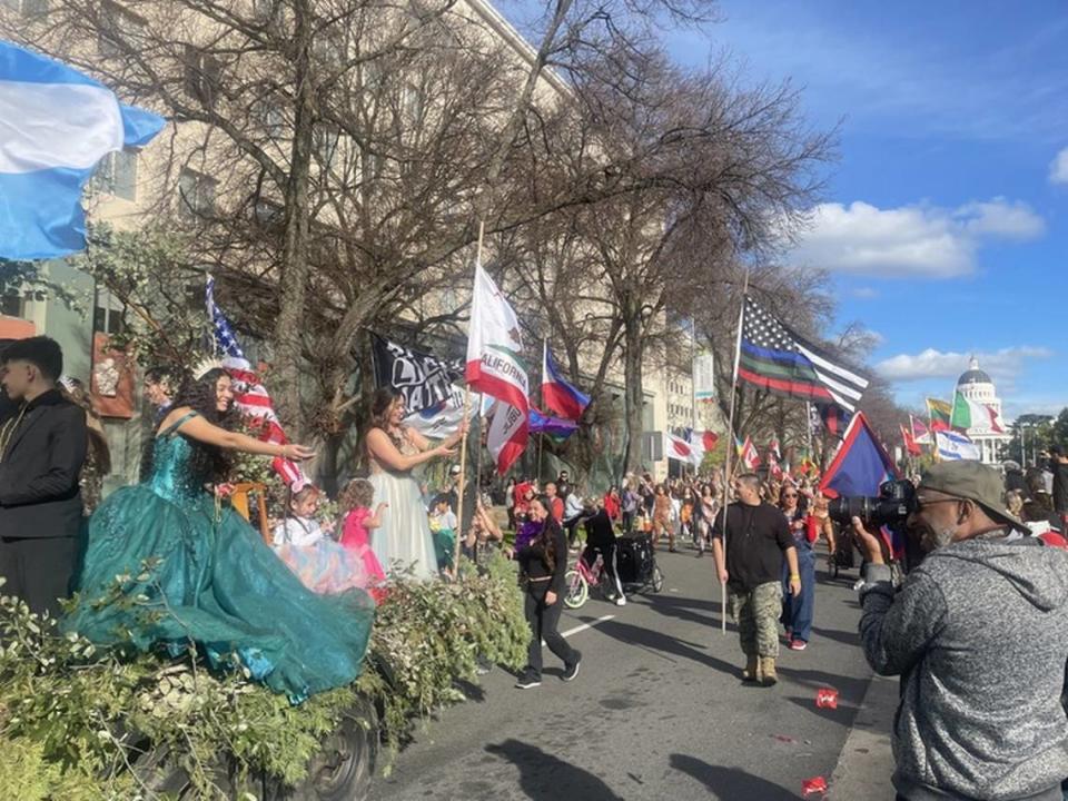 One of the floats during the City of Trees Parade rolls by thousands standing by in the audience.