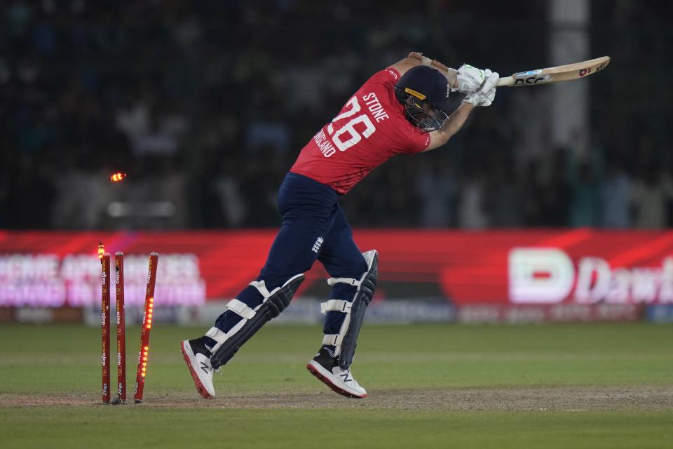 England's Olly Stone is bowled out by Pakistan's Harif Rauf during the fourth twenty20 cricket match between Pakistan and England, in Karachi, Pakistan, Sunday, Sept. 25, 2022. (AP Photo/Anjum Naveed)