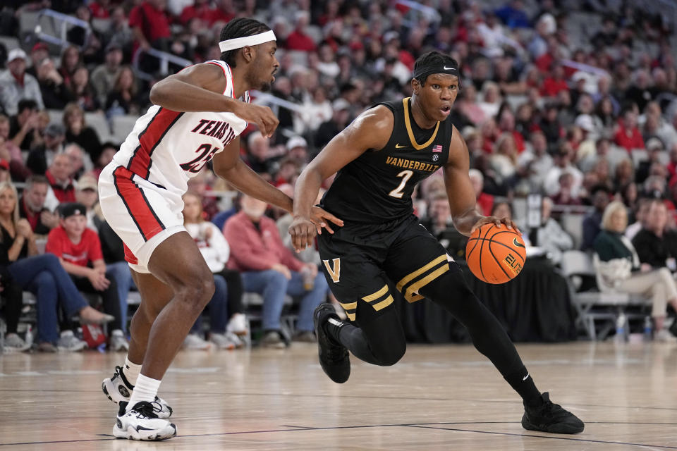 Vanderbilt forward Ven-Allen Lubin (2) works to the basket against Texas Tech forward Robert Jennings (25) in the second half of an NCAA college basketball game in Fort Worth, Texas, Saturday, Dec. 16, 2023. (AP Photo/Tony Gutierrez)