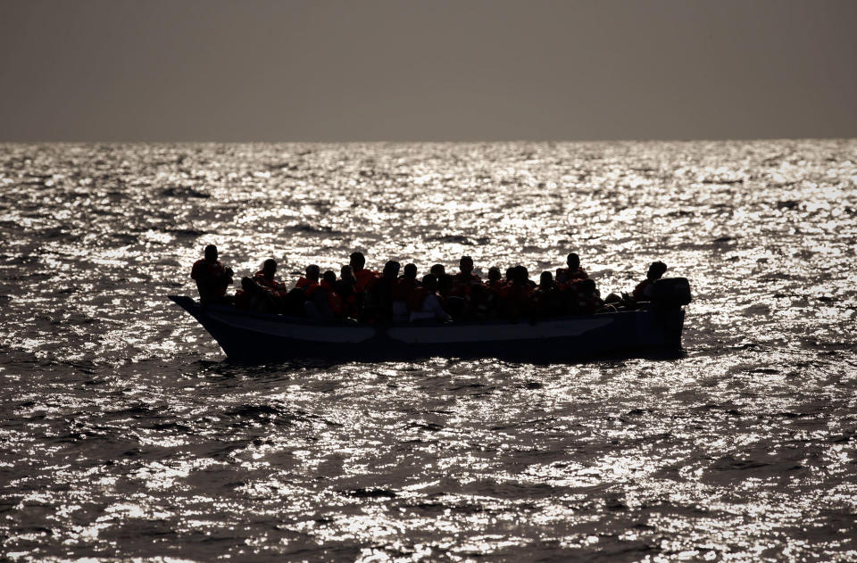 <p>Migrants who are fleeing Libya, crowded onto a dinghy before being helped by members of a Spanish NGO, during a rescue operation at the Mediterranean sea, about 25 miles north of Sabratha, Libya, Thursday, Aug. 18, 2016. (AP Photo/Emilio Morenatti) </p>