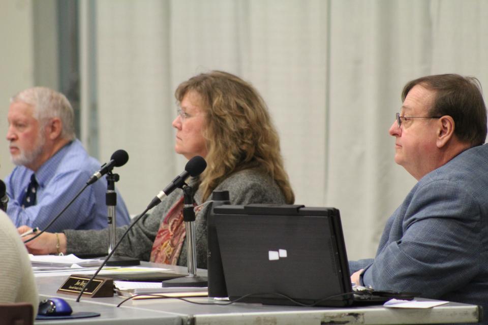 Cascade County Commissioners Jim Larson, Rae Grulkowski, and Joe Briggs (left to right) listen to public comment during Tuesday's commission meeting.