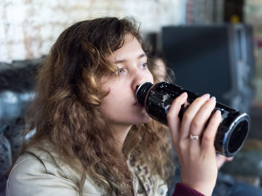 woman drinking water bottle