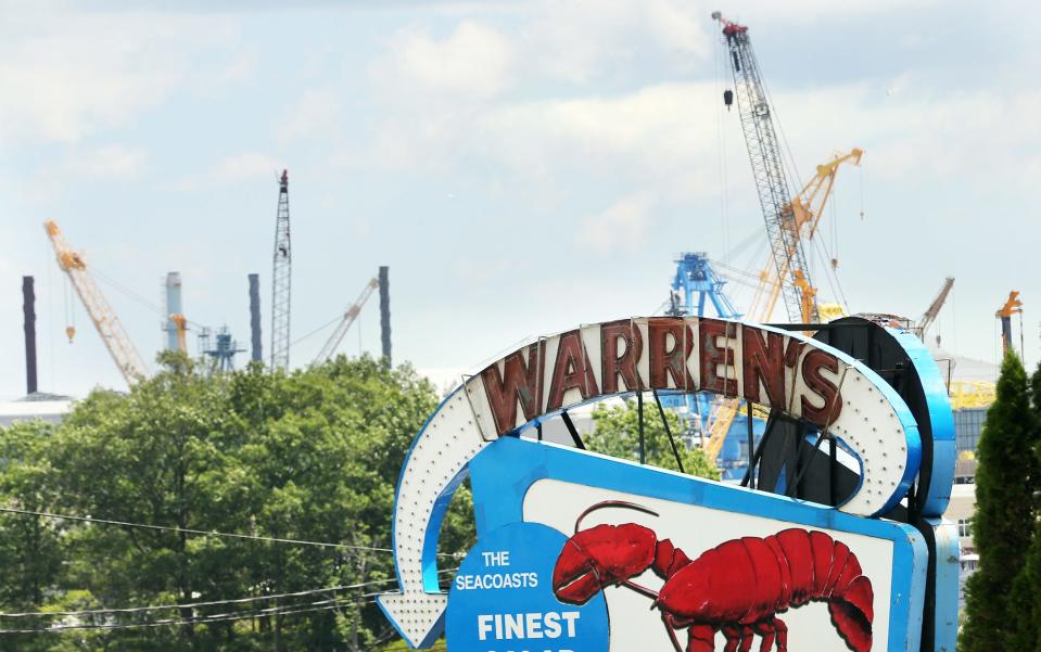 The Portsmouth Naval Shipyard is seen across the river from the well loved Warren's Loster House in Kittery Aug. 11, 2023. The Cunningham family is considering selling Warren’s and the entire property after being approached by the potential buyer in the spring.