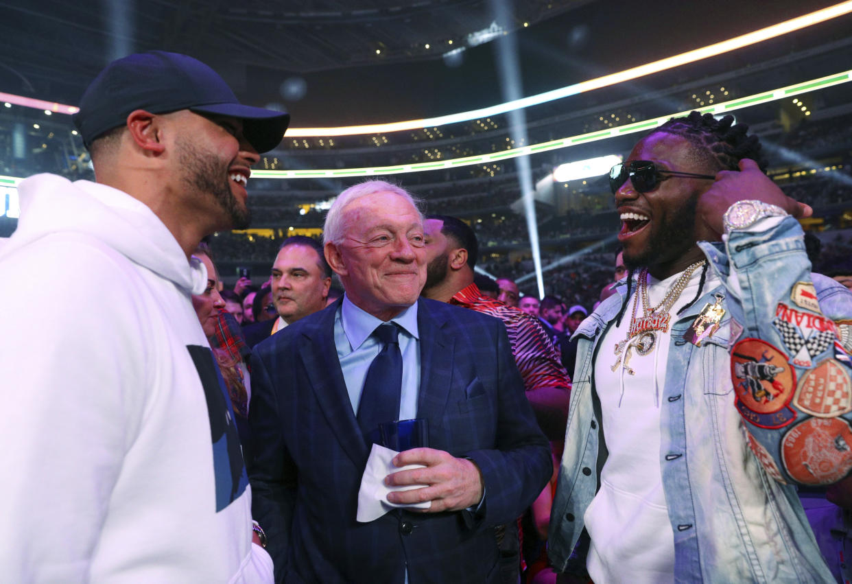 Dallas Cowboys defensive end DeMarcus Lawrence, right, said he is indifferent to team owner Jerry Jones' silence in the wake of George Floyd's death that sparked protests and social unrest around the country. (AP Photo/Richard W. Rodriguez)