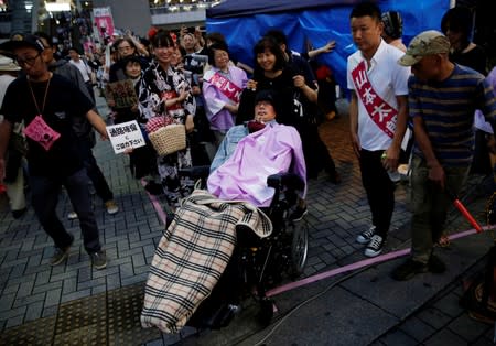 Reiwa Shinsengumi's disabled candidate for Japan's July 21 upper house election Yasuhiko Funago, who has ALS, attends an election rally in Tokyo