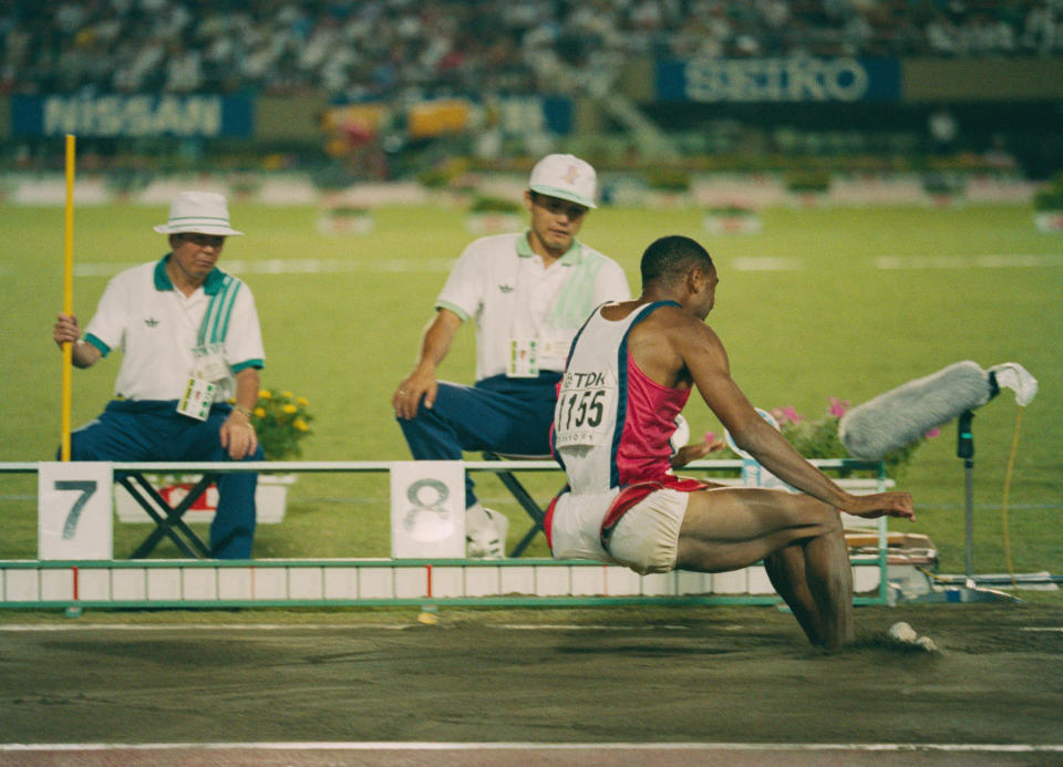 Mike Powell of the United State making his world record leap during the Long Jump event at the IAAF World Athletic Championships on 30th August 1991 at the Olympic Stadium in Tokyo, Japan. Powell broke Bob Beamon's 23-year-old long jump world record by 5 cm (2 inches), leaping 8.95 m (29 ft 4 in). (Photo by Bob Martin/Getty Images)