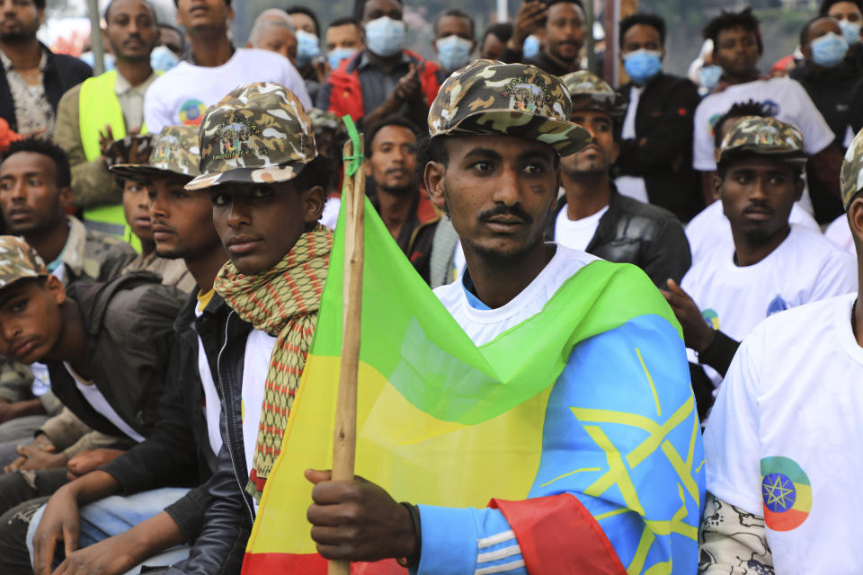 Youth joining the Defense Forces are escorted to Meskel Square, in Addis Ababa, Ethiopia, Tuesday, July 27 2021. A repatriation program is underway for young people from Ethiopia who have decided to join the Defense Forces. (AP Photo)