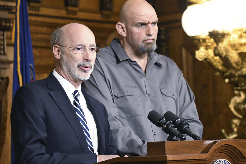 FILE - Pennsylvania Gov. Tom Wolf speaks at a news conference with Lt. Gov. John Fetterman in his Capitol reception room Jan. 24, 2019 in Harrisburg, Pa. Despite the relatively low profile, Democratic senators saw Fetterman as an extension of the Wolf administration, able to relay the governor’s priorities or stances on legislation before the chamber, state Senate Minority Leader Jay Costa, D-Allegheny, said. (AP Photo/Marc Levy, File)