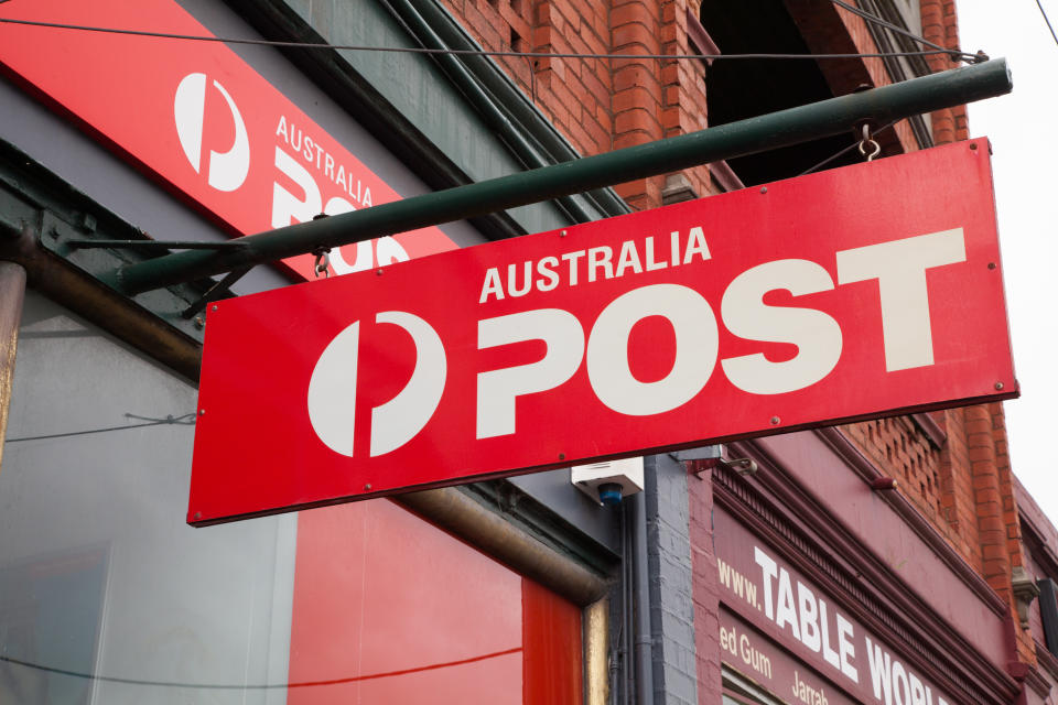 Melbourne, Australia - December 7, 2014: Australia Post is the national supplier of postal services in Australia. This is the Australia Post sign hanging outside a street front store in Hawthorn, Melbourne, Australia.