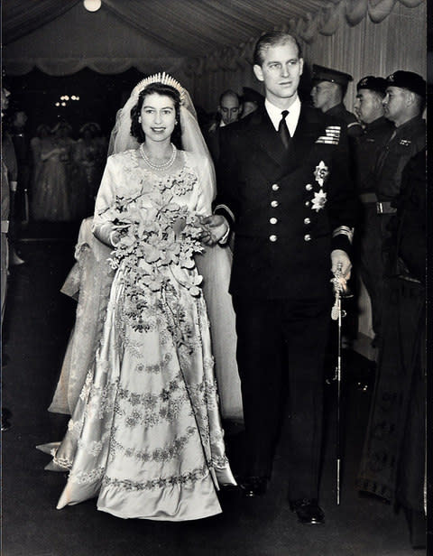 Queen Elizabeth II with Prince Philip leaving Westminster Abbey after their wedding in 1947 - Credit:  PA