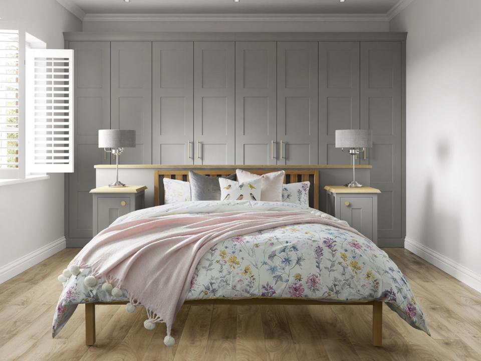 <p>Whatever your interior style, pink and grey bedrooms are perfect for all. If you're not feeling bold enough to dabble in pink paint, why not paint your wall (or wardrobe doors) grey instead. Finish off the look with pink soft furnishings, whether it's cushions or a throw, and you'll have the ultimate relaxed retreat. </p><p><strong>•</strong> Laura Ashley fitted bedroom by <a href="https://www.symphony-group.co.uk/brands/urbano-bedrooms/" rel="nofollow noopener" target="_blank" data-ylk="slk:Symphony;elm:context_link;itc:0;sec:content-canvas" class="link ">Symphony</a> in Marston Cobble Grey </p>