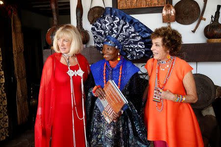 Carol Beckwith and Angela Fisher speak with the Nigerian artist and designer Chief Nike Okundaye during a gala marking the launch of their book called "African Twilight: The Vanishing Rituals and Ceremonies of the African Continent" at the African Heritage House in Nairobi, Kenya March 3, 2019. REUTERS/Baz Ratner