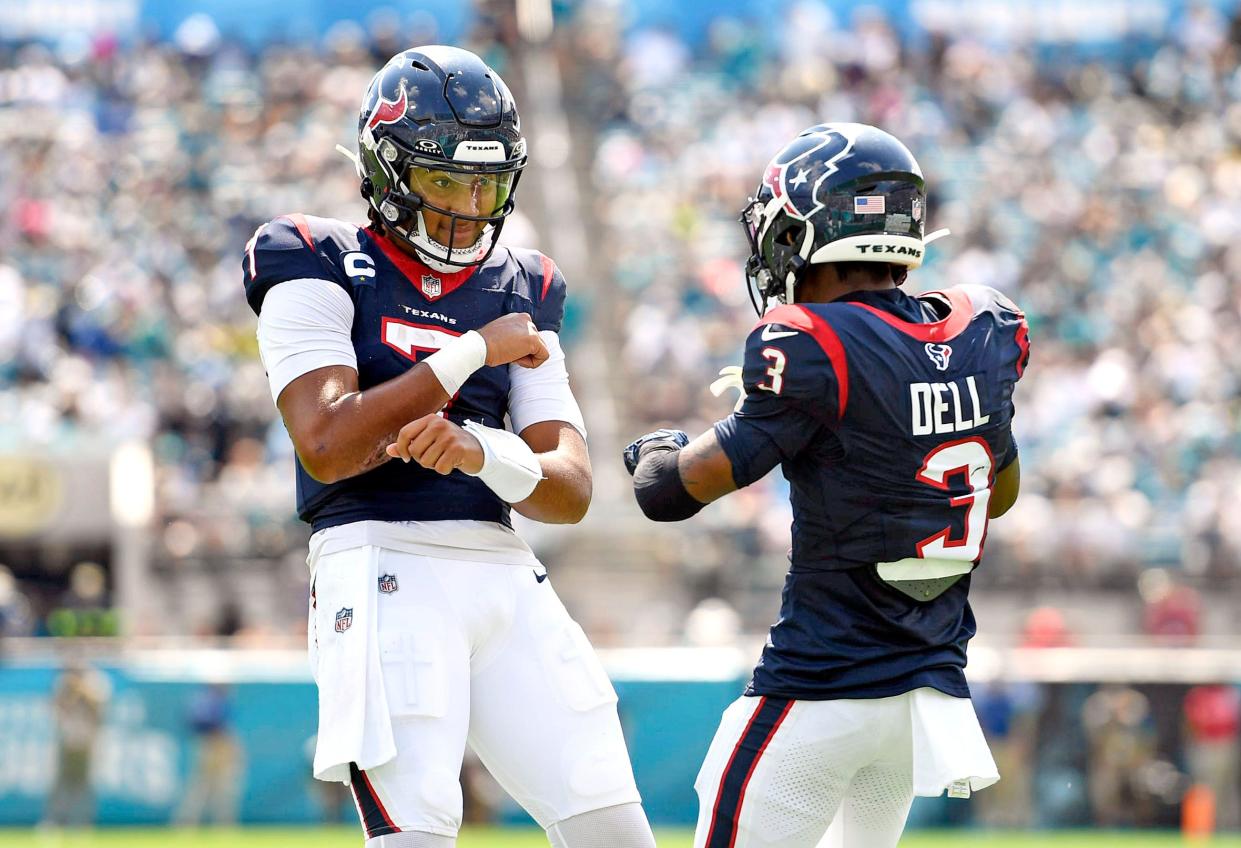 Tank Dell celebrates a touchdown with QB CJ Stroud this past Sunday in Jacksonville.