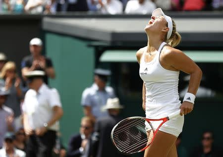 Britain Tennis - Wimbledon - All England Lawn Tennis & Croquet Club, Wimbledon, England - 5/7/16 Germany's Angelique Kerber celebrates winning her match against Romania's Simona Halep REUTERS/Stefan Wermuth