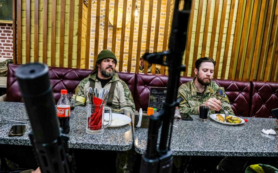 Special forces of the Ukrainian army have lunch in a restaurant in Bakhmut - Rick Mave