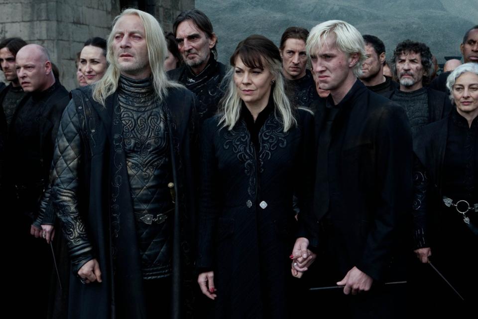 Helen McCrory, centre, as Narcissa Malfoy with Jason Isaacs, left, and Tom Felton, right in Harry Potter and the Deathly Hallows Part 2, 2011 - Hollywood Archive