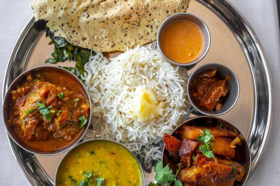 The Nepali thali with chicken is served with rice, naan, achaar and fried saag at Everest Nepalese and Indian Cuisine at 1801 Alexandria Dr. In Lexington, Ky. Tuesday, April 11, 2023