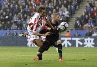<p>Stoke City’s Peter Crouch in action with Leicester City’s Kasper Schmeichel </p>