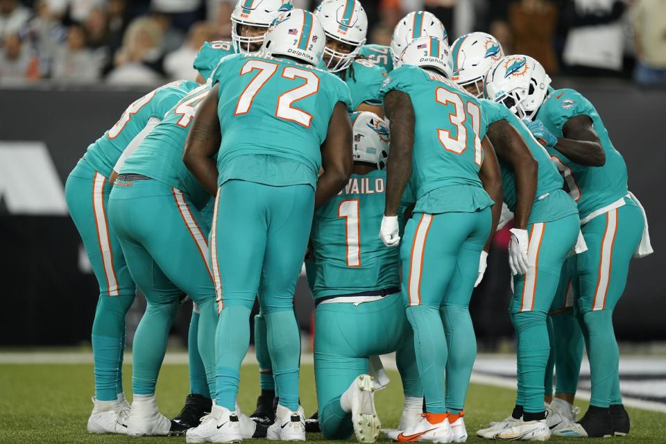 Miami Dolphins quarterback Tua Tagovailoa (1) calls a play during the first half of an NFL football game against the Cincinnati Bengals, Thursday, Sept. 29, 2022, in Cincinnati. (AP Photo/Joshua A. Bickel)