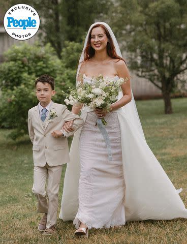 <p>Taralynn Lawton</p> Eva Amurri's son Major walks his mom down the aisle at her June 29 wedding