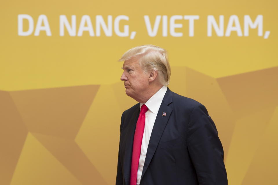 FILE - In this Nov. 11, 2017, file photo, U.S. President Donald Trump makes his way to a plenary session at the APEC Summit in Danang, Vietnam. Trump said Tuesday, Feb. 5, 2019 that he will hold a two-day summit with North Korea leader Kim Jong Un Feb. 27-28 in Vietnam to continue his efforts to persuade Kim to give up his nuclear weapons. As a single-party communist state, Vietnam boasts tight political control and an efficient security apparatus, and successfully hosted the APEC meetings in 2017, and the regional edition of the high-powered World Economic Forum in 2018, both in the central coastal city of Danang. (Adrian Wyld/The Canadian Press via AP, File)
