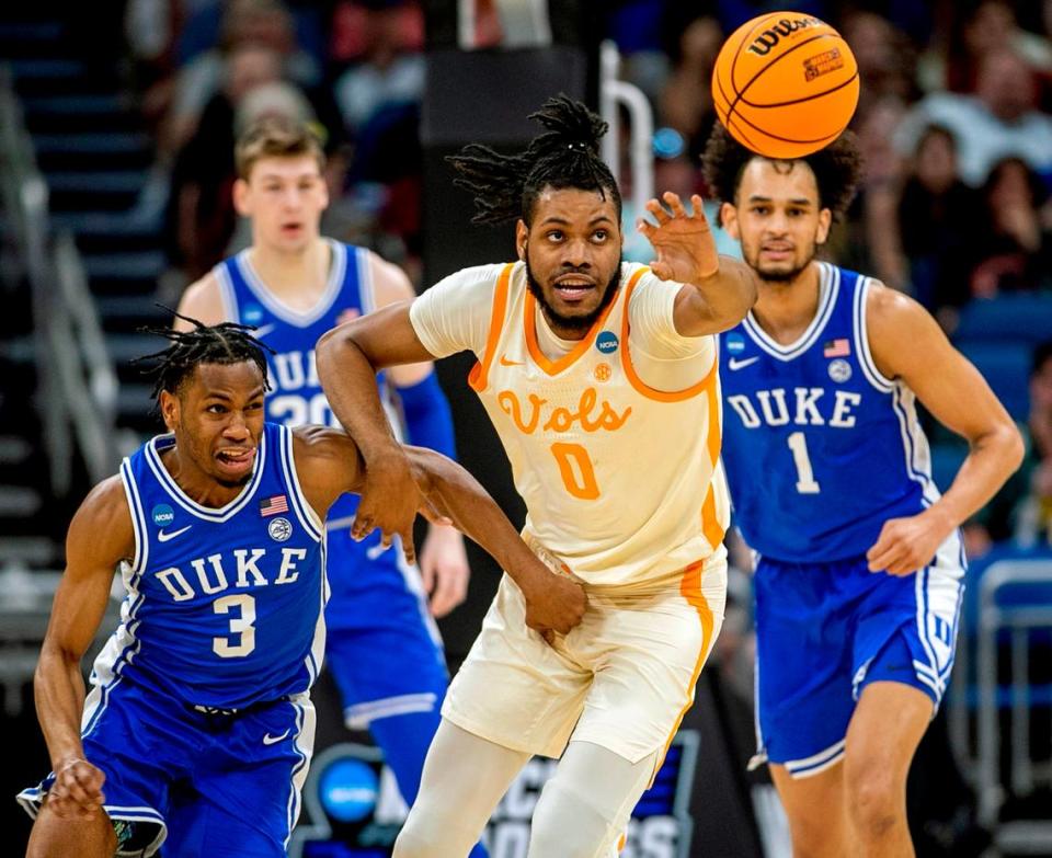 Duke’s Jeremy Roach (3) and Tennessee’s Jonas Aidoo (0) battle for a loose ball in the first half during the second round of the NCAA Tournament on Saturday, March 18, 2023 at the Amway Center in Orlando, Fla.