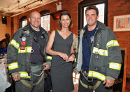 NEW YORK, NY - APRIL 19: Actress Bridget Moynahan (C) with the NYFD at the 2012 Tribeca Film Festival Jury lunch at the Tribeca Grill Loft on April 19, 2012 in New York City. (Photo by Mike Coppola/Getty Images for Tribeca Film Festival)