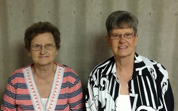 This undated photo shows from left, Carole Grisham and Marsha Hall. The sisters who had worked at the Beshear Funeral Home — 80-year-old Carole Grisham and 72-year-old Marsha Hall — decided to stay put in their home, which lacked a basement, as the tornado barreled down on Dawson Springs, Ky. (Courtesy of Jason Cummins via AP)