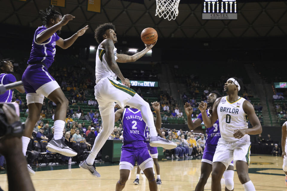 Baylor forward Jalen Bridges attempts a basket over Tarleton State forward Coreyoun Rushin in the first half of an NCAA college basketball game, Tuesday, Dec. 6, 2022, in Waco, Texas. (AP Photo/Rod Aydelotte)