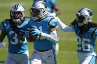 Carolina Panthers outside linebacker Jeremy Chinn (21) is congratulated by free safety Tre Boston (33) and cornerback Donte Jackson (26) following an interception during the second half of an NFL football game against the Chicago Bears in Charlotte, N.C., Sunday, Oct. 18, 2020. (AP Photo/Brian Blanco)