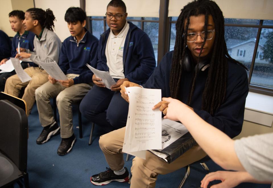 Alvin Newson, 16, looks over music notes with his peers during his music class with Jasmine Fripp (not pictured), a music educator at KIPP Nashville Collegiate High School in Nashville, Tenn., Friday, Jan. 12, 2024.