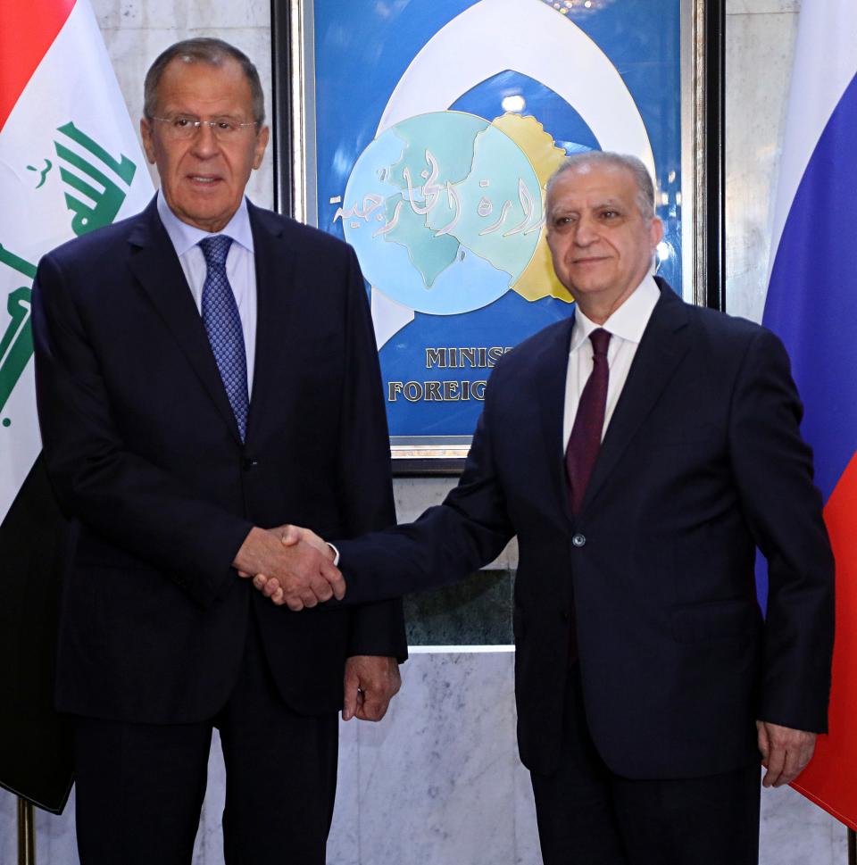 Iraqi Foreign Minister Mohamed Alhakim, right, shakes hands with his visiting Russian counterpart Sergey Lavrov at the Ministry of Foreign Affairs in Baghdad, Iraq, Monday, Oct. 7, 2019. (AP Photo/Hadi Mizban)