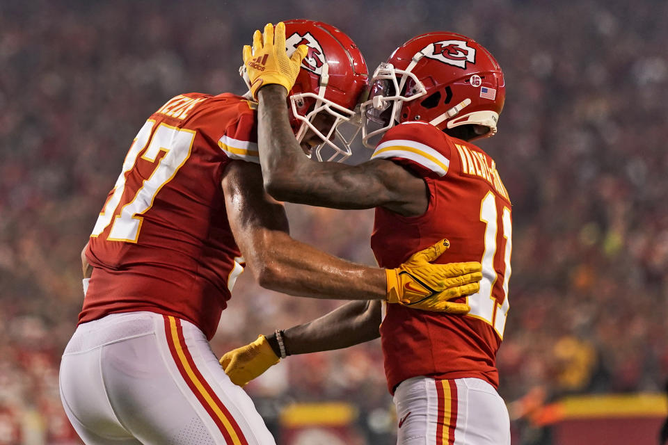 Kansas City Chiefs tight end Travis Kelce, left, is congratulated by wide receiver Marquez Valdes-Scantling (11) after scoring during the first half of an NFL football game against the Las Vegas Raiders Monday, Oct. 10, 2022, in Kansas City, Mo. (AP Photo/Charlie Riedel)