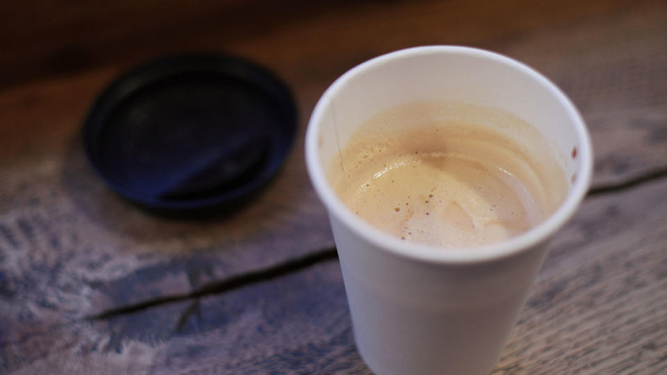 Pictured is a plastic coffee cup and lid.