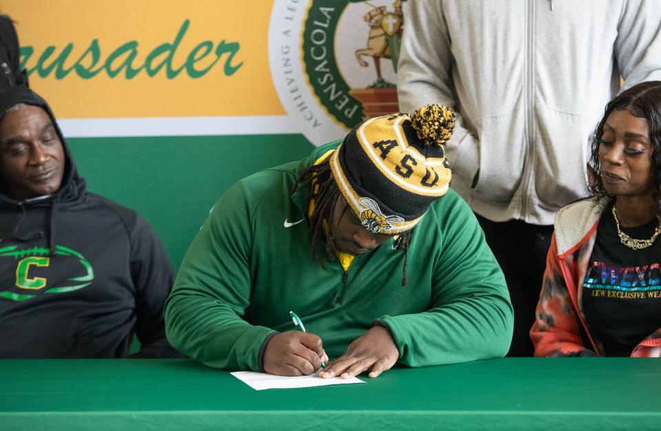 Desjon Robertson signs with Alabama State University on Early National Signing Day at Pensacola Catholic High School on Wednesday, Dec. 20, 2023.