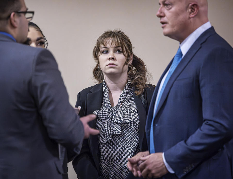 "Rust" movie armorer Hannah Gutierrez-Reed, center, talks with her attorney Jason Bowles, right, and her defense team during her involuntary manslaughter trial, Tuesday, March 5, 2024, at the First Judicial District Courthouse in Santa Fe, N.M. (Jim Weber/Santa Fe New Mexican via AP, Pool)