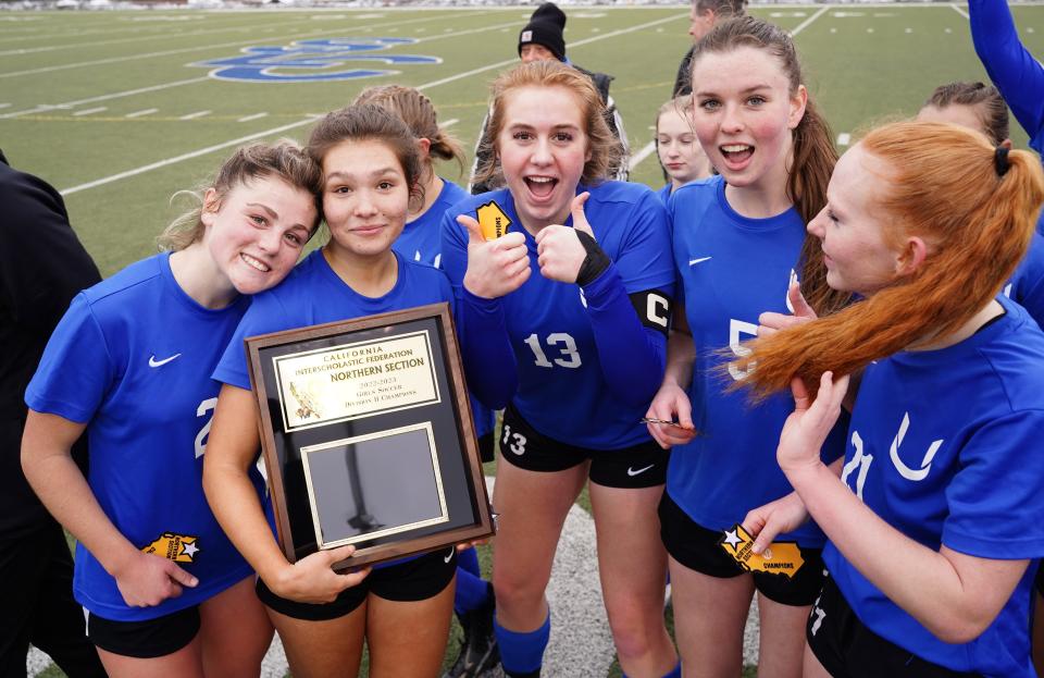 Ellie Farber (23), Adiah Edwardson (4), Raegan Salado (13), Grace Erickson (5) celebrates after winning the NSCIF Division II Championship against Live Oak on Saturday afternoon, Feb. 25, 2023. The Panthers defeated Live Oak 4 - 0.
