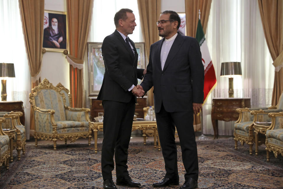 Secretary of Iran's Supreme National Security Council Ali Shamkhani, right, welcomes French presidential envoy Emmanuel Bonne for their meeting in Tehran, Iran, Wednesday, July 10, 2019. (AP Photo/Vahid Salemi)