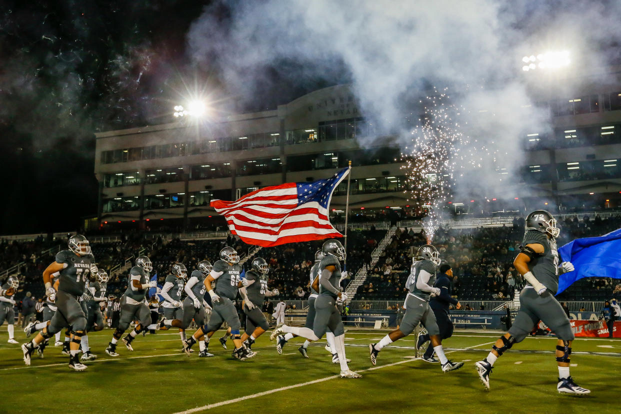 RENO, NV - NOVEMBER 10: Nevada Wolf Pack run onto the field for the game between the Nevada Wolf Pack and the Colorado State Rams at Mackay Stadium on November 10, 2018 in Reno, Nevada. (Photo by Jonathan Devich/Getty Images)