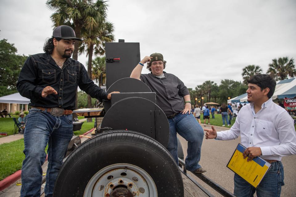 H.M. Kingsville seniors, from left, Joel Salazar, Morgan Guerra and Juan Mireles, explain their barbecue pit with a firebox during an agricultural mechanics project show at Texas A&M-Kingsville on Tuesday, April 23, 2024, in Kingsville, Texas.