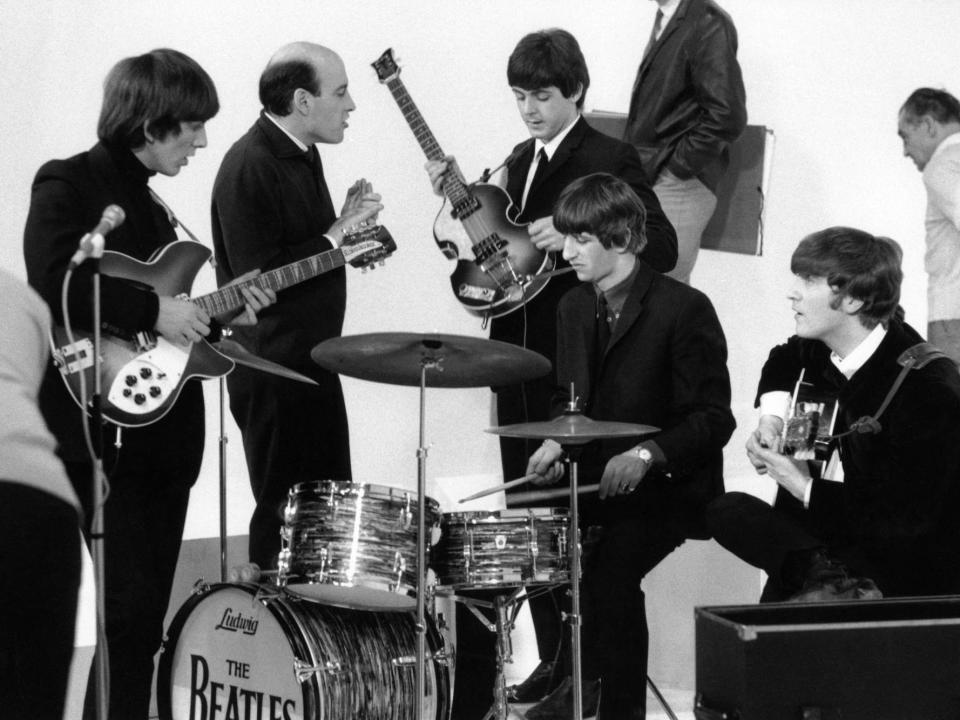 George Harrison, Richard Lester, Paul McCartney, Ringo Starr & John Lennon filming "A Hard Day's Night."